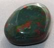this is a photo of bloodstone, a green and red jasper from India and used for crystal healing