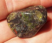 This is a photo of tumbled african bloodstone from western australia, not africa and metaphysically is used to detoxify organs and purify one's blood