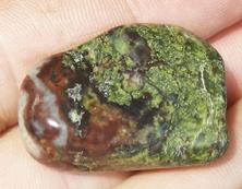 This is a photo of tumbled african bloodstone from western australia, not africa and metaphysically is used to detoxify organs and purify one's blood