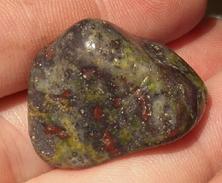 This is a photo of tumbled african bloodstone from western australia, not africa and metaphysically is used to detoxify organs and purify one's blood