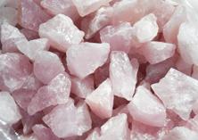 Photo of rough rose quartz from Brazil for tumbling rock, pink ray of love stone