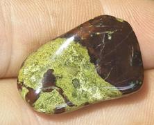 This is a photo of tumbled african bloodstone from western australia, not africa and metaphysically is used to detoxify organs and purify one's blood