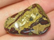 This is a photo of tumbled african bloodstone from western australia, not africa and metaphysically is used to detoxify organs and purify one's blood