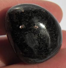 Photo of tumbled Nuummite from Greenland