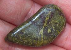 This is a photo of tumbled african bloodstone from western australia, not africa and metaphysically is used to detoxify organs and purify one's blood