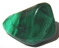 Photo of tumbled malachite from Zaire, protects children, stone called "mirror of the soul", copper mineral, also found in Congo