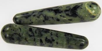 Photo of two massage wands made of green and black nephrite INCA jade from Peru