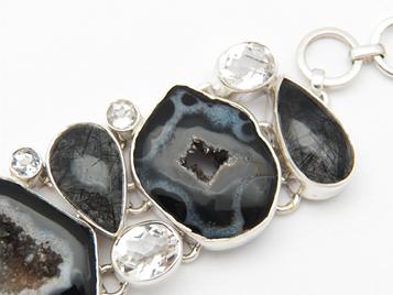 photo of black agate geode and 925 sterling silver bracelet with tourmalated quartz and faceted crystal quartz