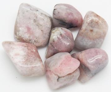 Photo of tumbled pink petalite from Karibib District, Erongo Region, Namibia, high in lithium content and used for balancing and calming emotions and energies