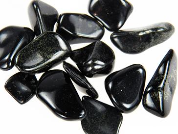 Photo of beautiful black nephrite "lemurian" jade from Peru in tumbled stone form contains inclusions of pyrite